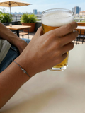 Adjustable string bracelet with letters