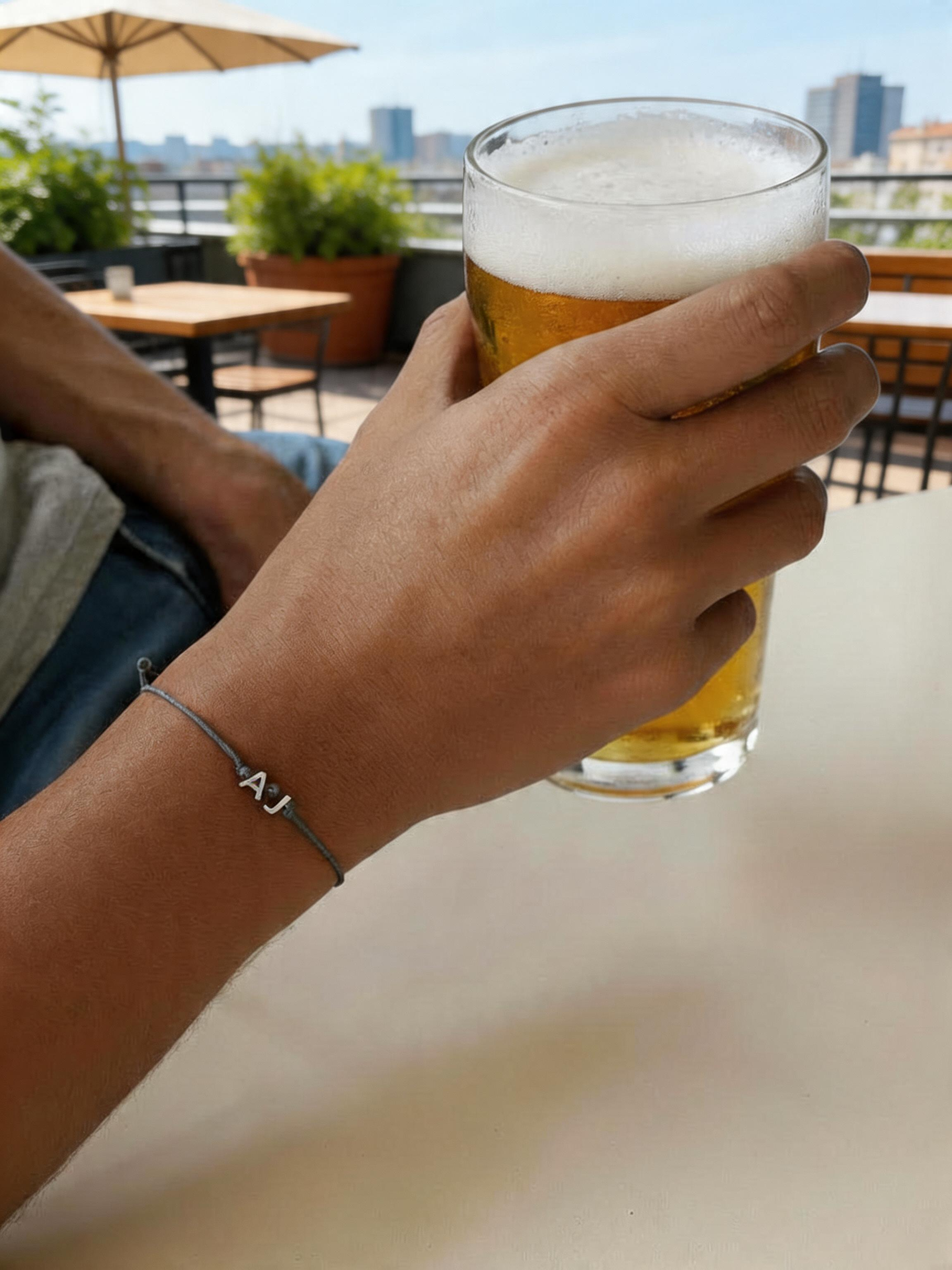 Adjustable string bracelet with letters